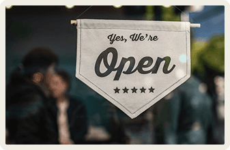 Yes We're Open sign